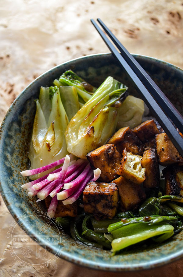 Five-spice crispy seared tofu with bok choy and watermelon radish in a large rice bowl