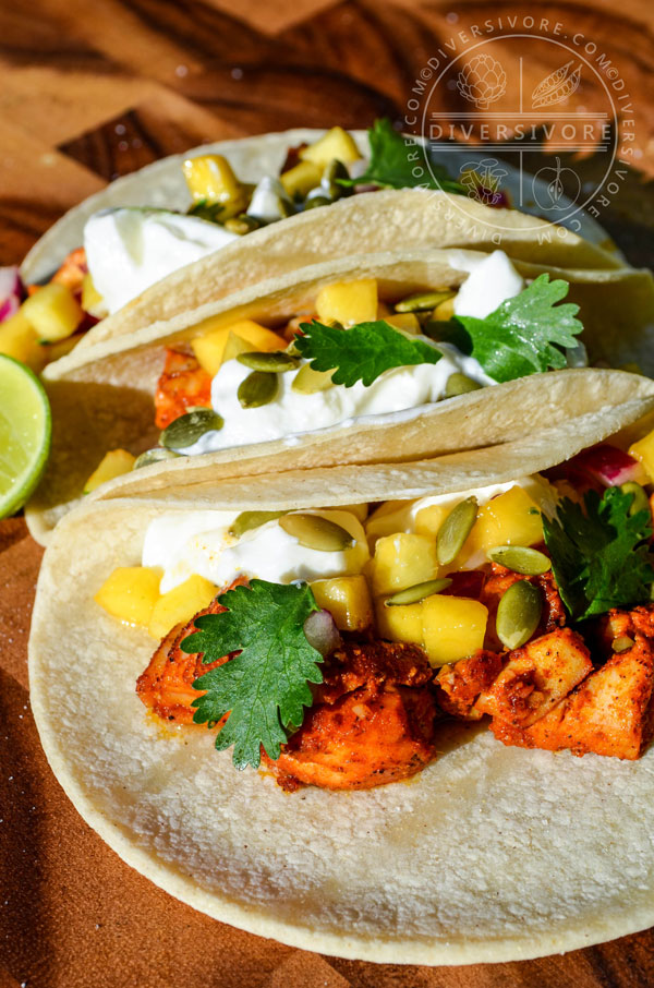 Yucatecan Fish Tacos with peach salsa, sour cream, and pumpkin seeds