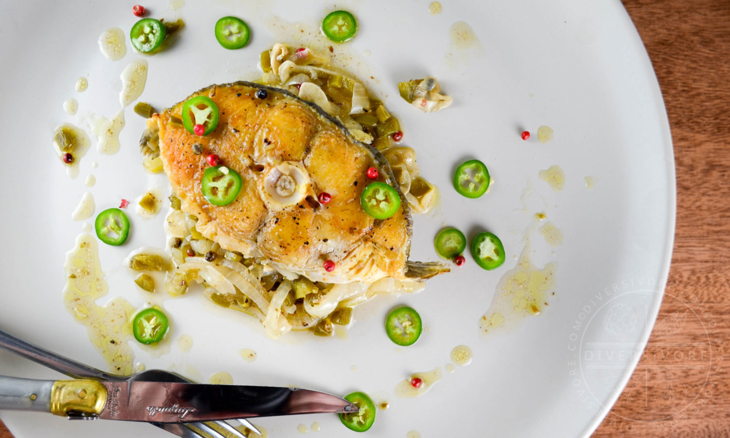 Halibut escabeche - cooked and marinated with olive oil, vinegar, garlic and jalapenos - Diversivore.com