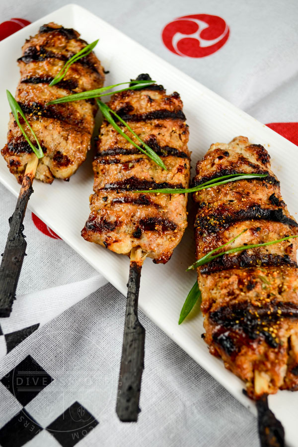 Grilled chicken tsukune (meatballs) on bamboo skewers