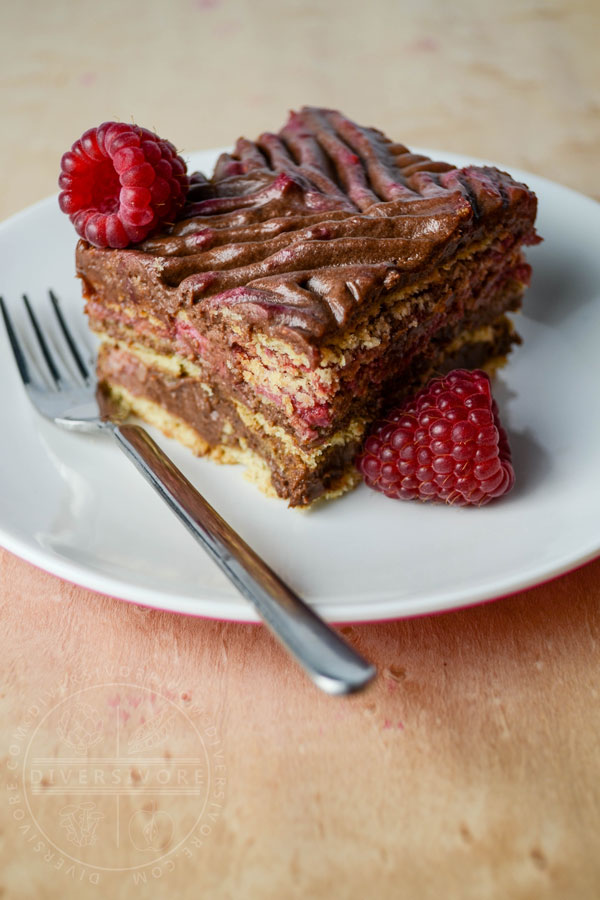 Chocolate Raspberry Rose Icebox Cake slice with a small fork on a white plate