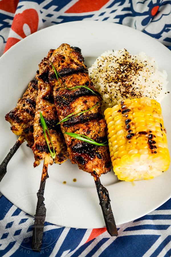 Miso grilled corn with butter, served alongside allergy-friendly grilled chicken tsukune
