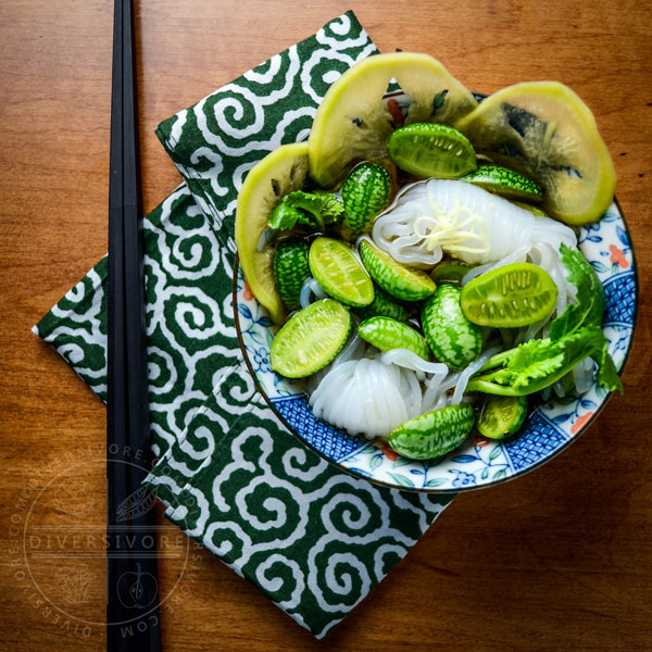 A bowl of cucamelon sunomono with chopsticks