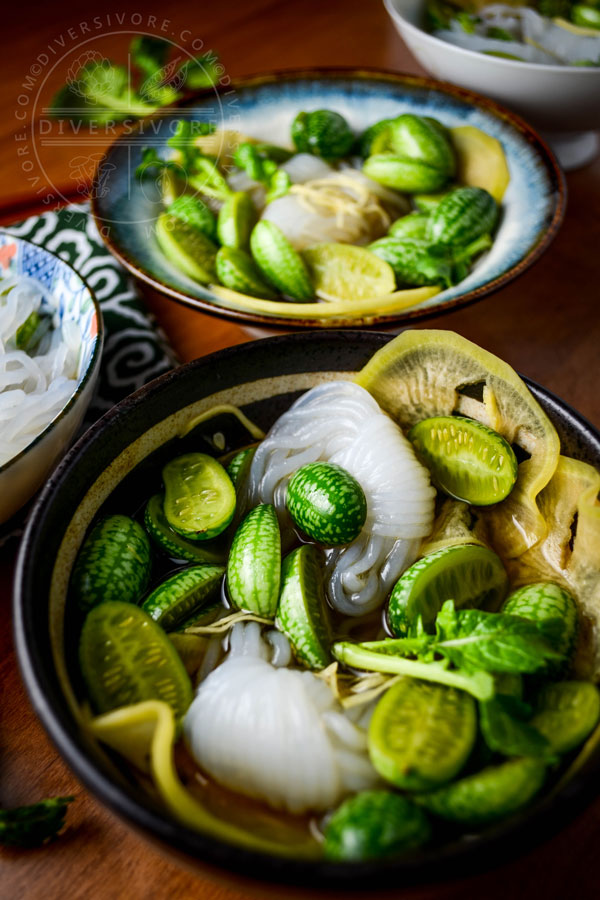 Bowls of cucamelon sunomono with chopsticks