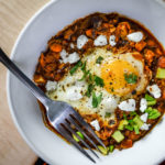 Shakshouka Rancheros - Eggs poached in a spiced tomato sauce, loaded with Mexican flavours and ingredients - Diversivore.com