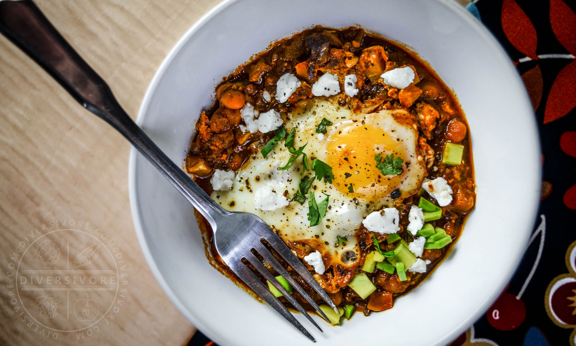 Shakshouka rancheros - eggs cooked in a tomato sauce with vegetables and Mexican ingredients