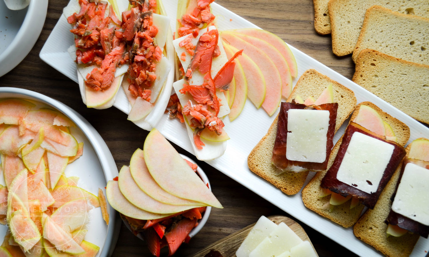 Pink Pearl apples and a charcuterie board with manchego, bison bresaola, smoked salmon, and endive - Diversivore.com