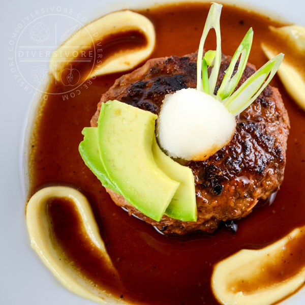 Wafu (Japanese-style) Hamburger on a white plate with karashi mustard/mayo and daikon oroshi