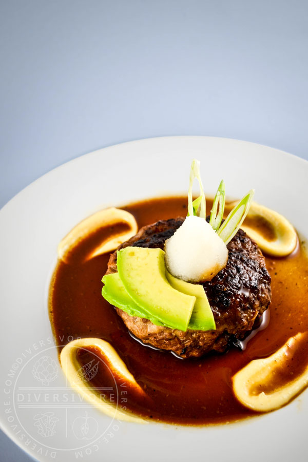 Wafu (Japanese-style) Hamburger on a white plate with karashi mustard/mayo and daikon oroshi