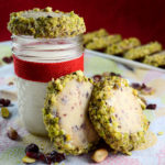 Cranberry shortbread, rolled in white chocolate and crushed pistachios - Diversivore.com
