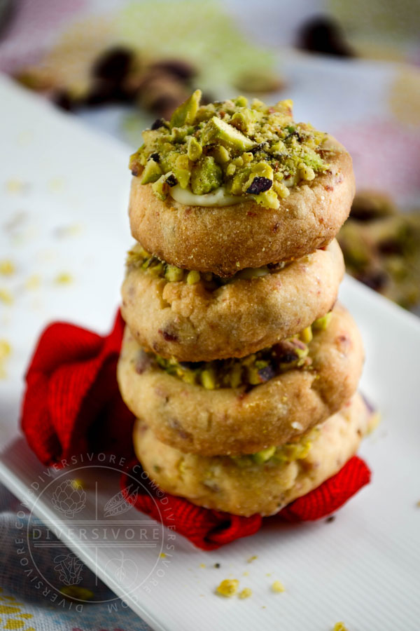 A stack of cranberry shortbread with white chocolate and pistachios