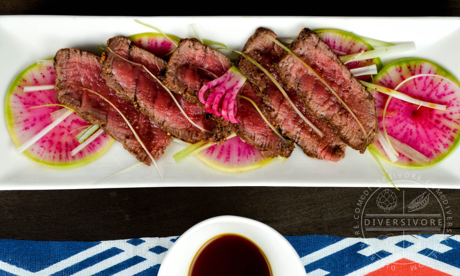 Appetizer portion of beef tataki with ponzu, watermelon radishes, and scallions - Diversivore.com