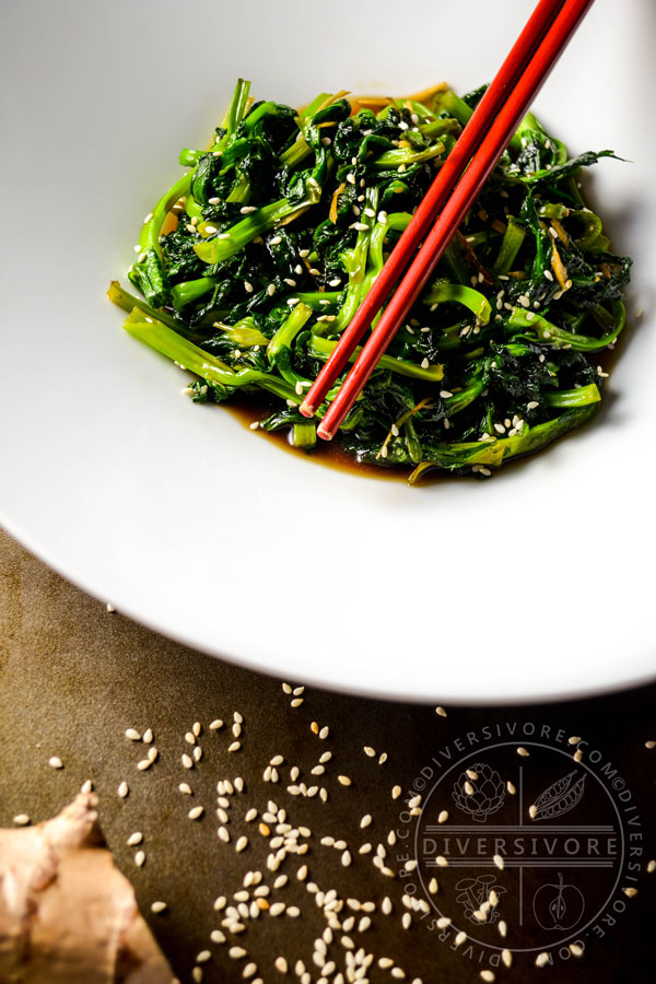 Honey and Ginger Pea Tips with chopsticks in a large white bowl