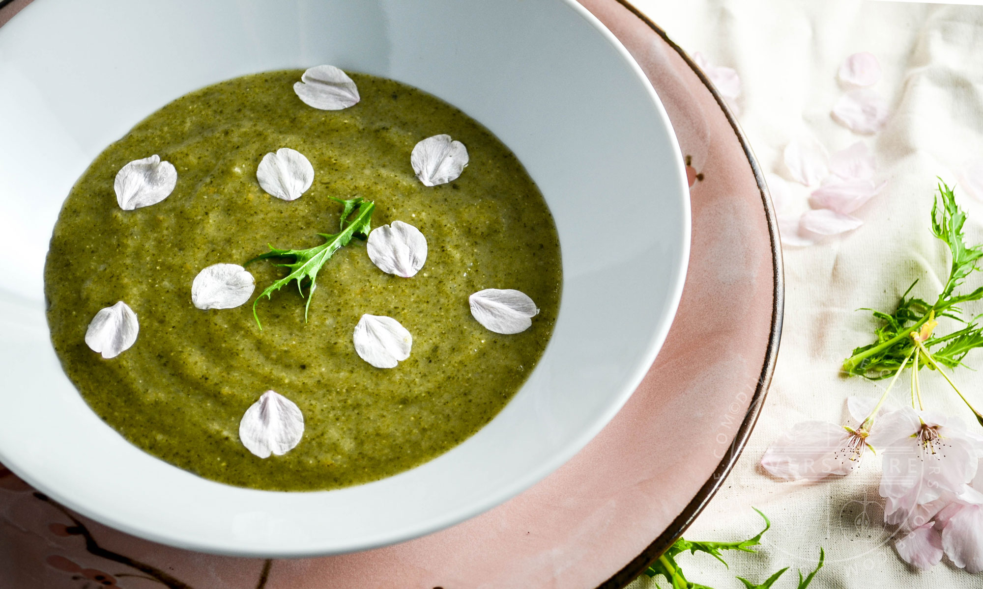 Japanese Nettle Soup, decorated with cherry petals and mizuna