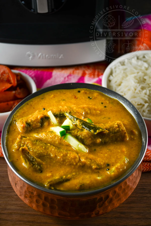 Roasted Okra Kuzhambu (South Indian Curry) in a copper serving dish