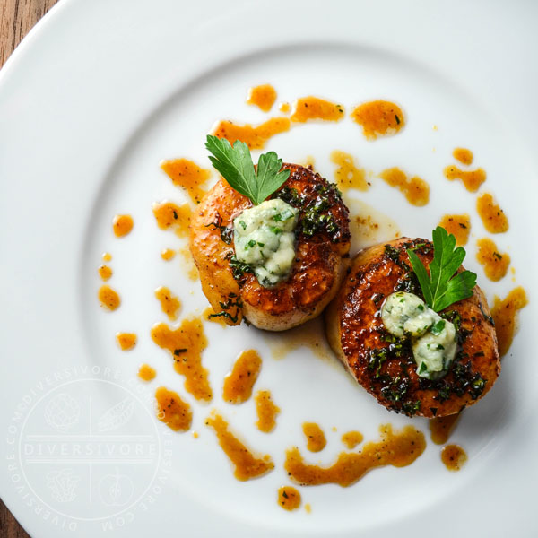 Seared scallops with a honey-parsley gastrique and blue cheese