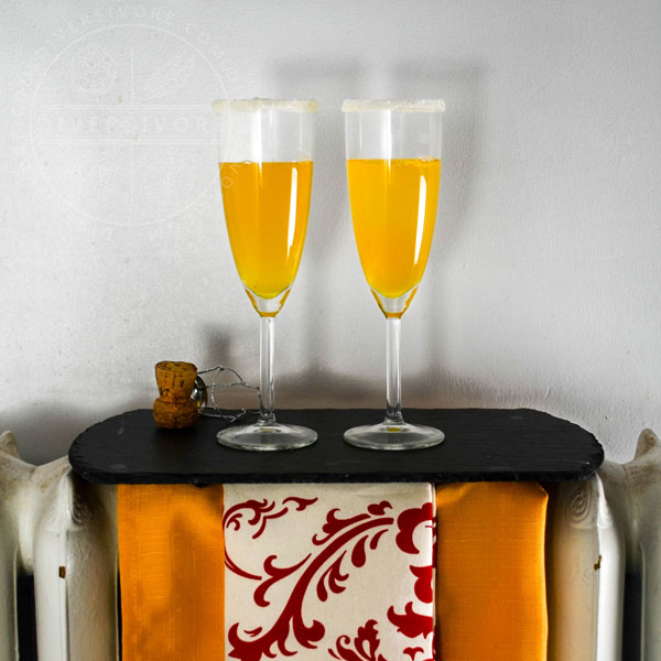 A pair of sparkling saffron cocktails on a tray