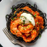 Spot Prawns in a spicy tomato sauce with mascarpone and nero di seppia (cuttlefish ink) pasta - Diversivore.com
