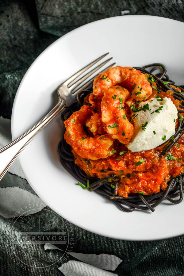 Spot prawns in a saffron tomato sauce with mascarpone cheese and nero di seppia pasta