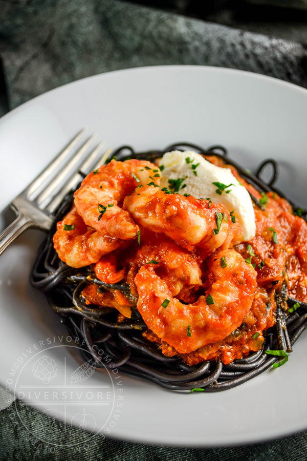 Spot prawns in a saffron tomato sauce with mascarpone cheese and nero di seppia pasta