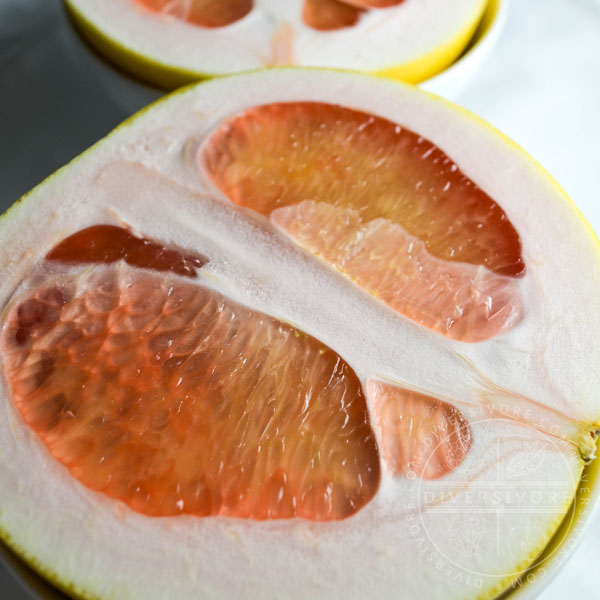 Pink-fleshed pomelo shown in cross-section.