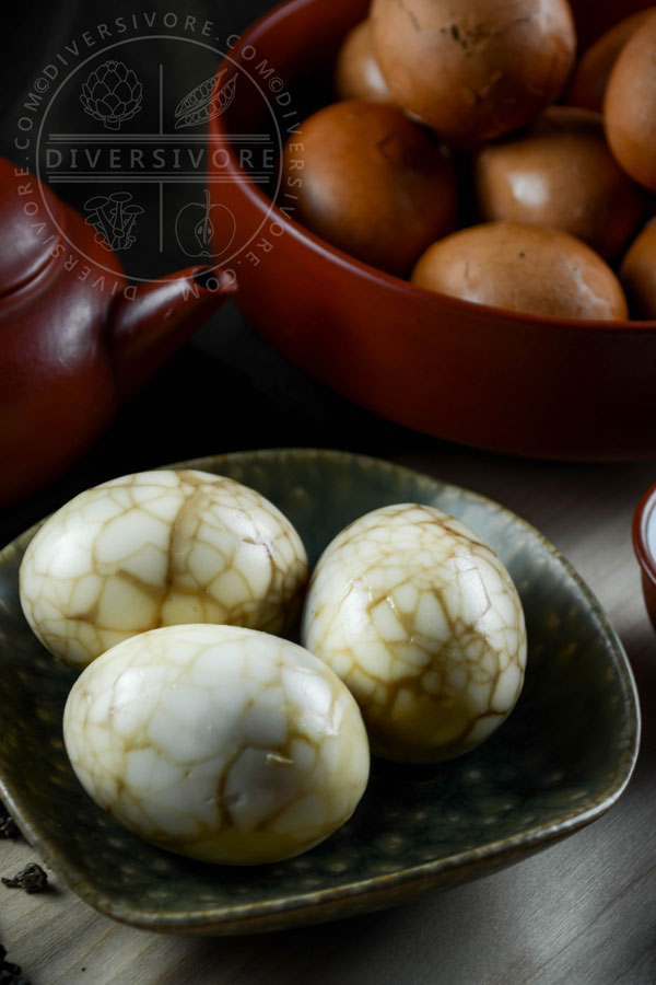 Peeled Taiwanese tea eggs in a ceramic dish