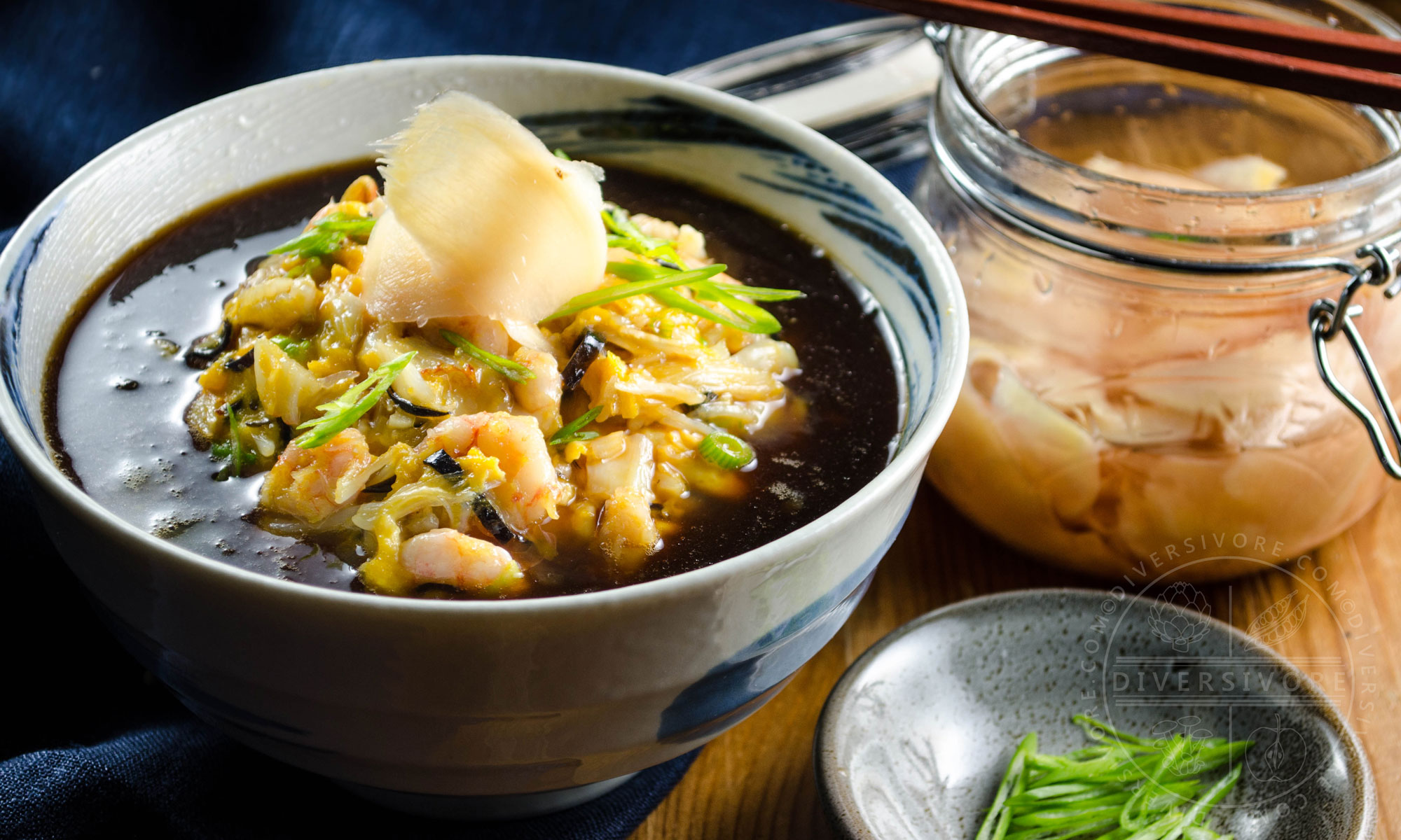 Tenshindon - A Japanese/Chinese crab and shrimp omelette served over rice and topped with a sweet and sour sauce, served in a large bowl and topped with pickled ginger