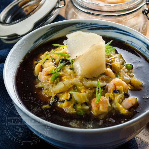 Tenshindon - A Japanese/Chinese crab and shrimp omelette served over rice and topped with a sweet and sour sauce, served in a large bowl and topped with pickled ginger