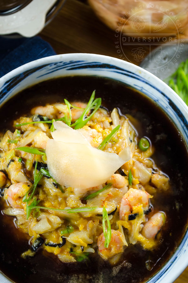 Tenshindon - A Japanese/Chinese crab and shrimp omelette served over rice and topped with a sweet and sour sauce, served in a large bowl and topped with pickled ginger