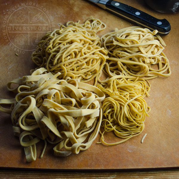 Homemade Chinese egg noodles cut into four different thicknesses.