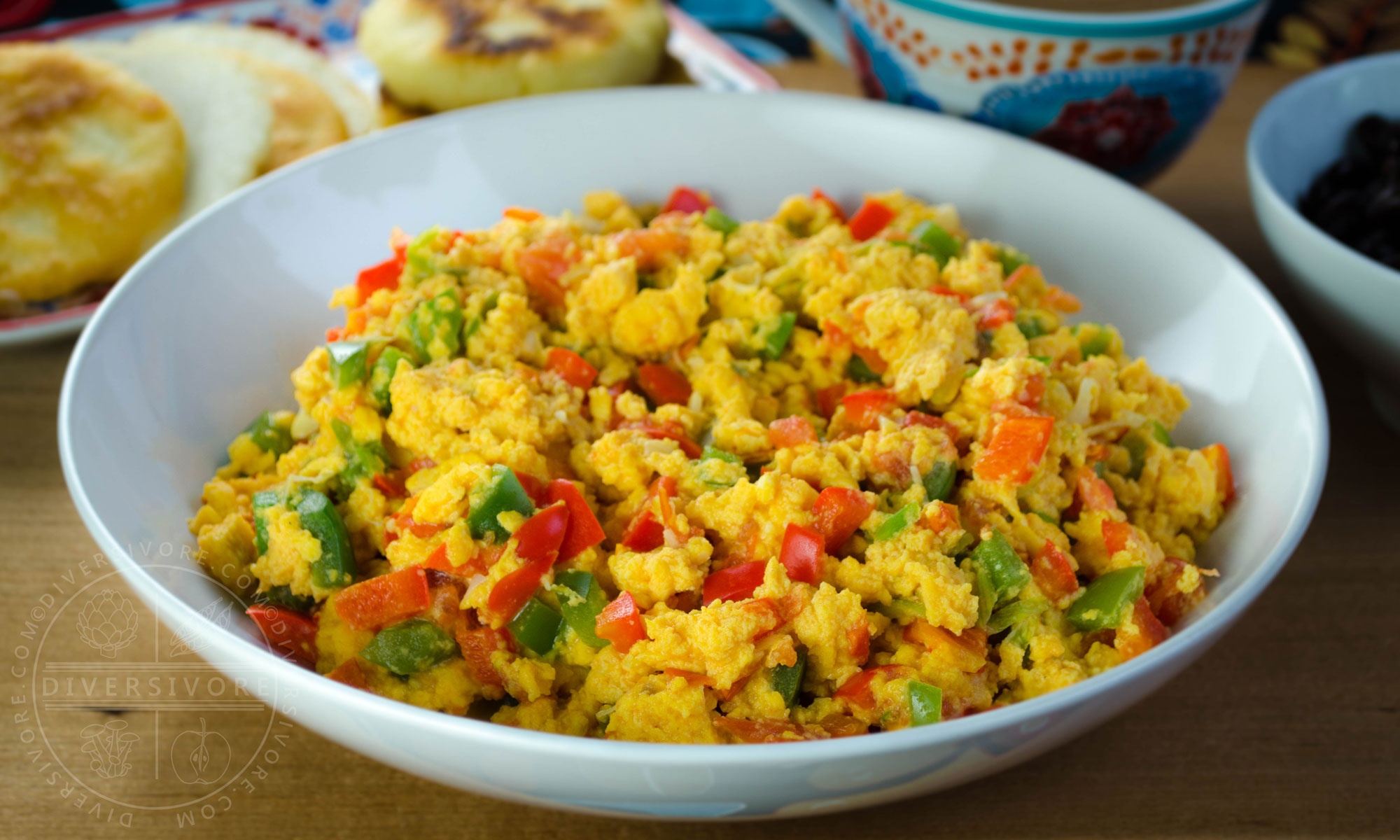Perico - Colombian/Venezuelan scrambled eggs with peppers, tomatoes, and onions, served in a shallow white bowl