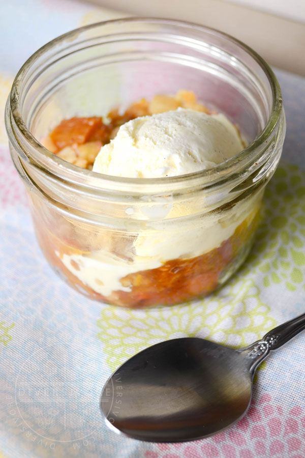 Rhubarb apple crisp with vanilla ice cream in a mason jar