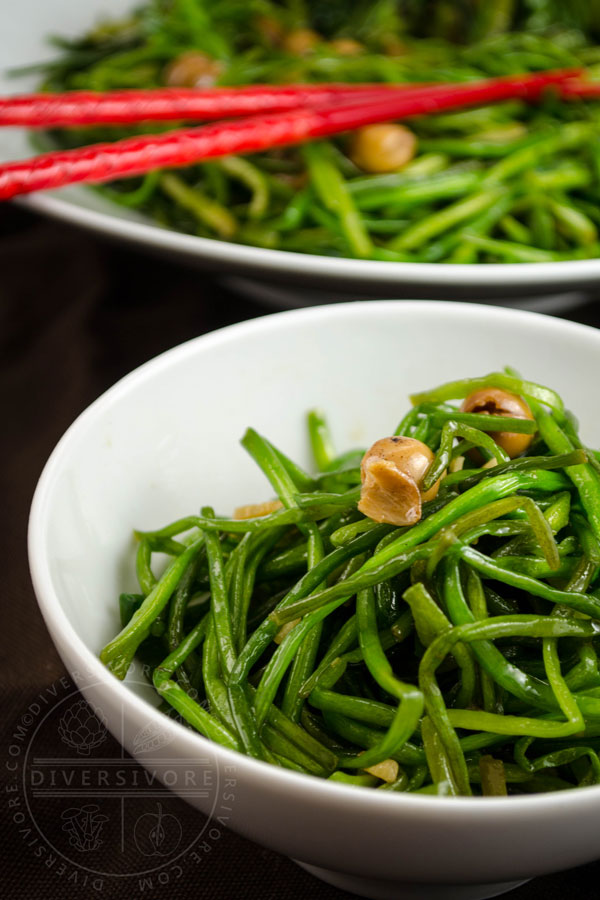 Stir-fried white water snowflake stems with po buzi (fragrant manjack), served in a white bowl