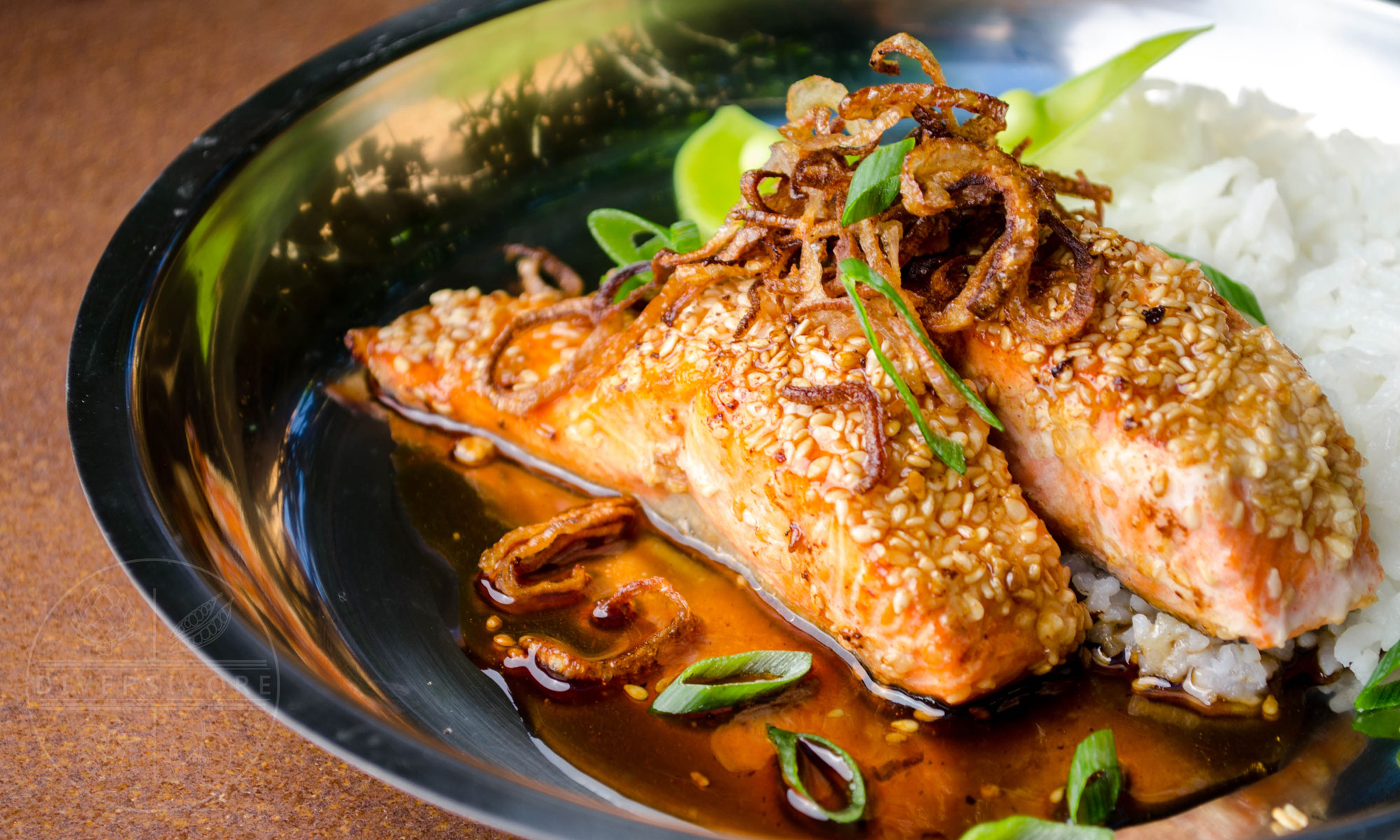 Sesame Salmon with Maple Soy Glaze, served with fried shallots and scallions