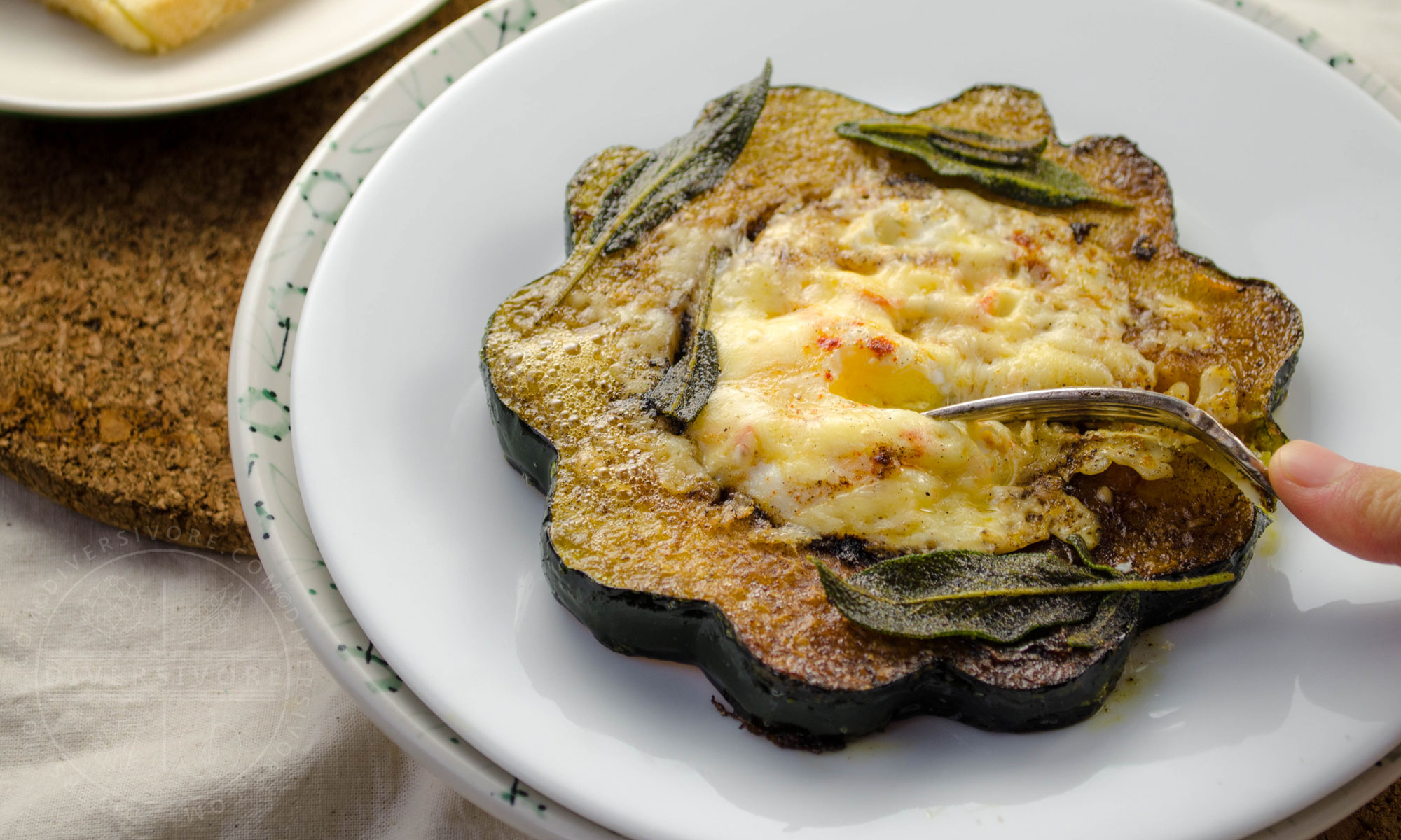 Squash Hole-in-One (aka Egg in a basket, aka Toad in the hole) made with eggs, acorn squash, aged cheddar, and fried sage