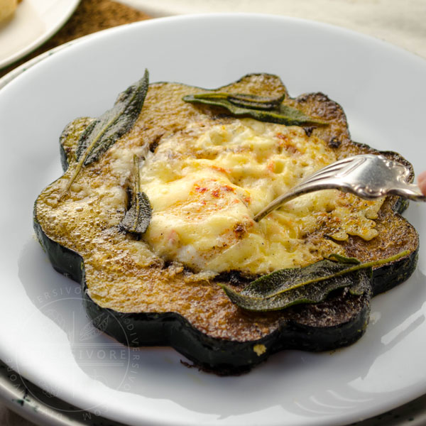 Squash Hole-in-One (aka Egg in a basket, aka Toad in the hole) made with eggs, acorn squash, aged cheddar, and fried sage