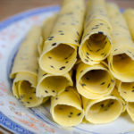 Chinese Crispy Egg Roll (Biscuit Roll) Cookies on a plate - Mobile banner - Diversivore.com