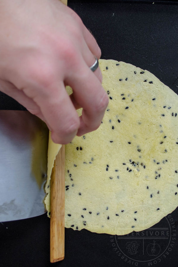 Step 2 - Lifting the edge over the stick and rolling the cookie