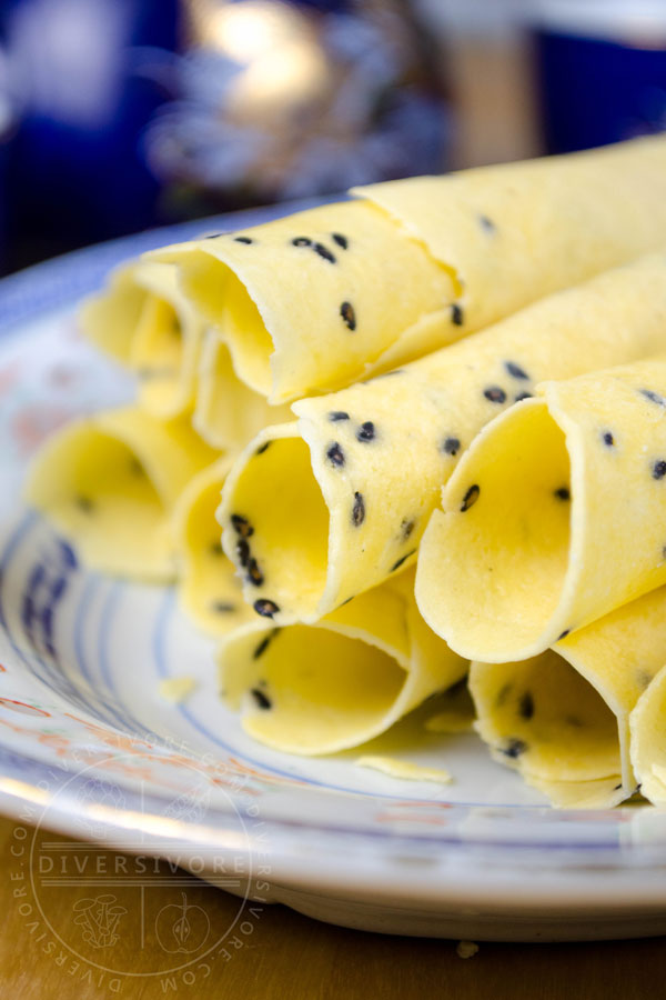 Chinese Crispy Egg Roll (Biscuit Roll) Cookies on a patterned Chinese plate