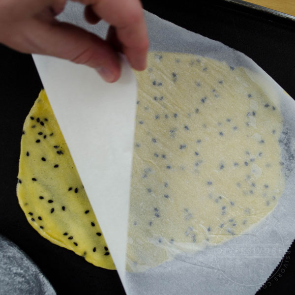 Taking off the parchment paper, checking for thin spots