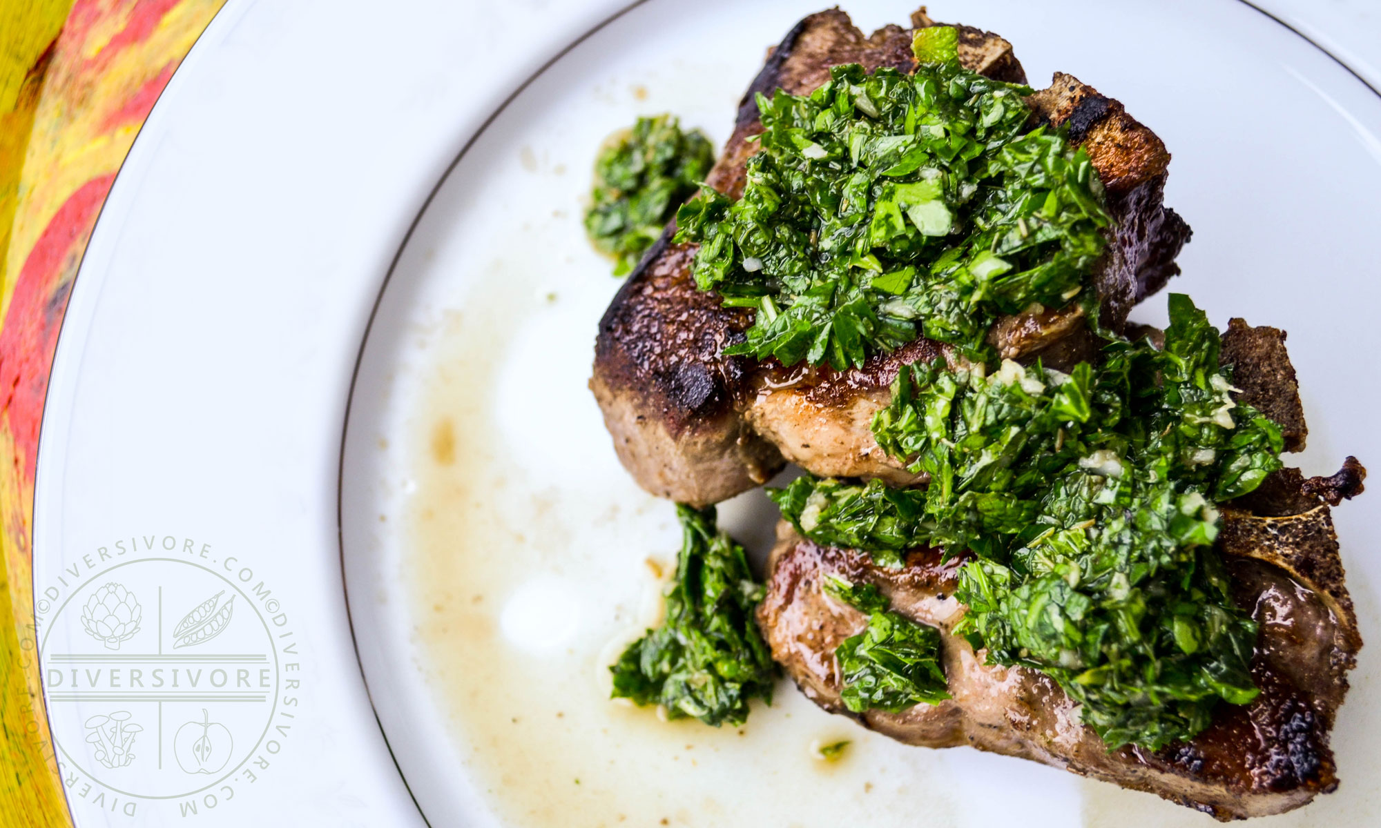 Lamb chop with mint chimichurri on a white plate