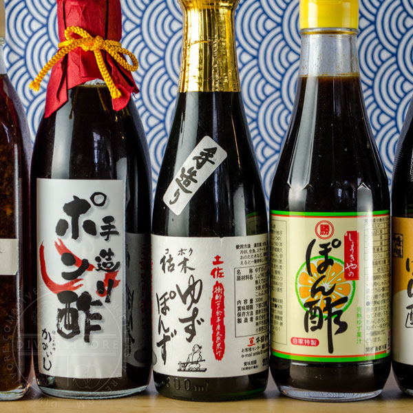 Various types of ponzu shoyu in glass bottles