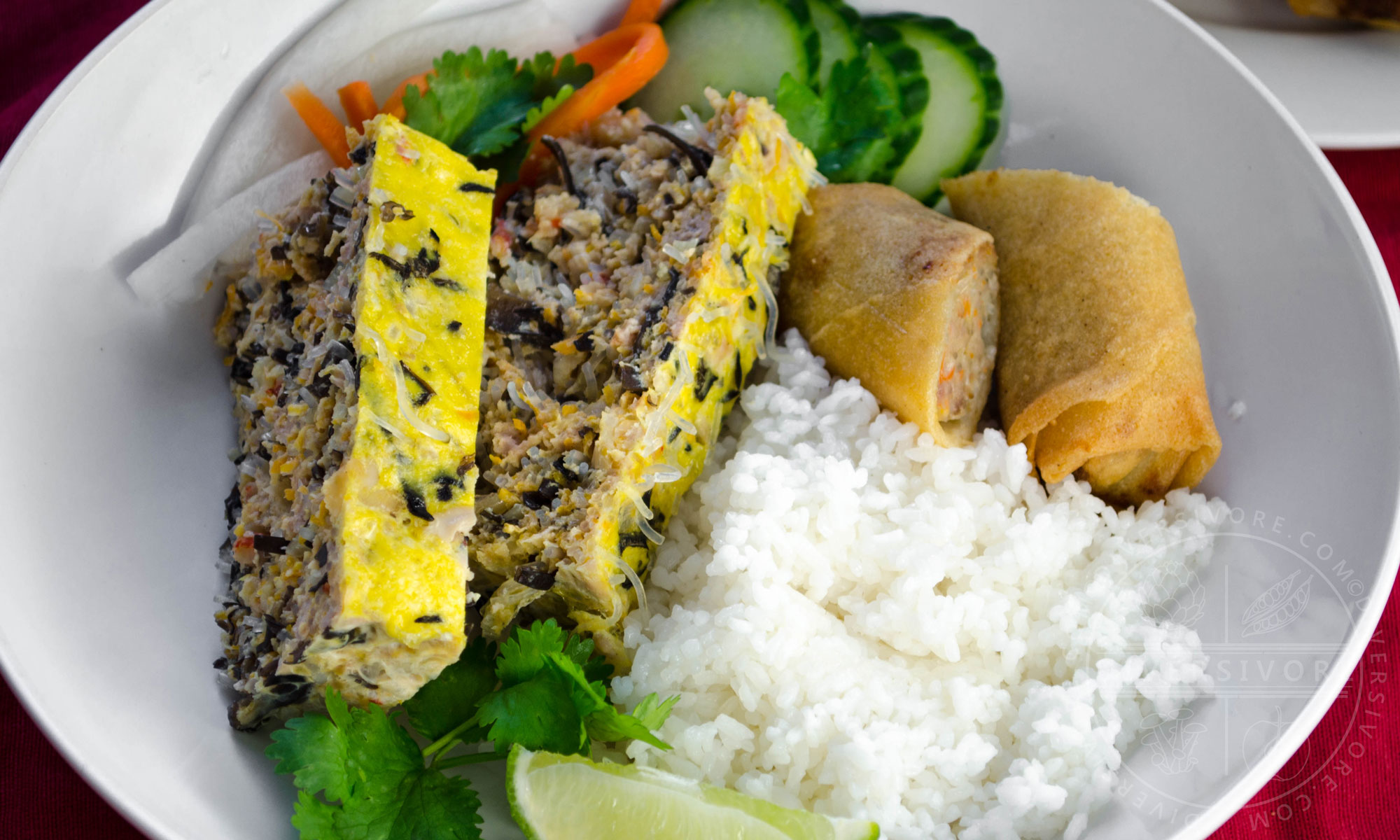 Vietnamese Egg Meatloaf (Chả Trứng Hấp) made with seafood, pork, noodles, eggs, and wood ear mushrooms, served with rice and spring rolls