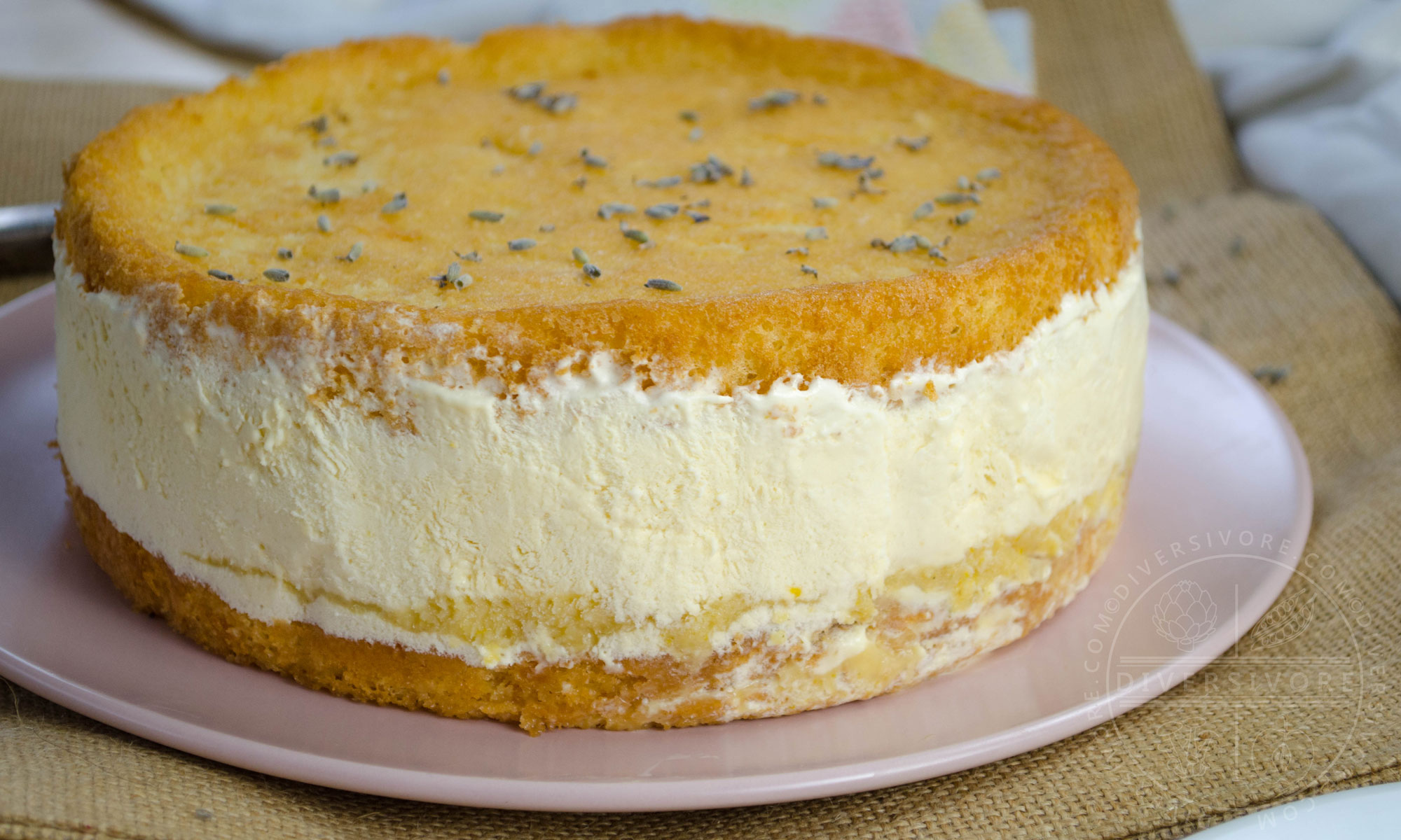 Lemon, Lavender, and Honey Semifreddo Cake on a pink plate against a burlap cloth