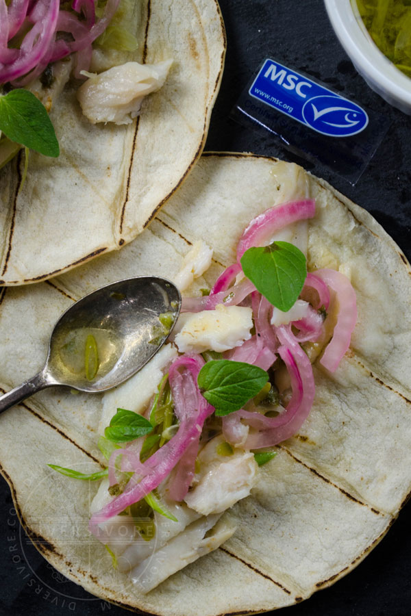 Pescado con vino - fish with white wine, cooked in a Mexican style, served in tacos with wine-pickled onions on a slate board, showing the Marine Stewardship Council logo