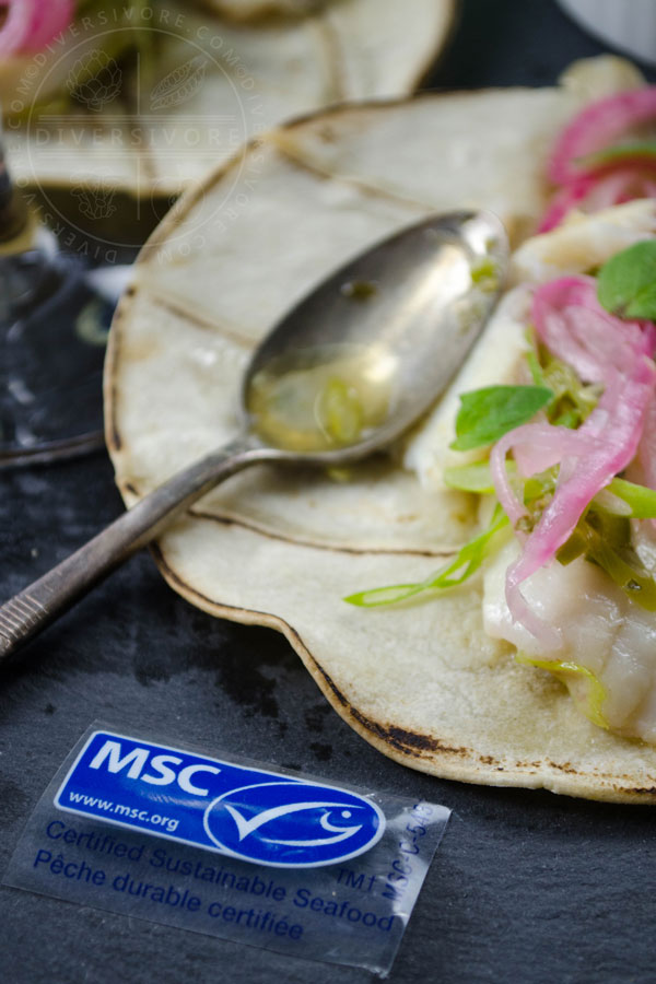 Pescado con vino - fish with white wine, cooked in a Mexican style, served in tacos with wine-pickled onions on a slate board with the Marine Stewardship Council logo