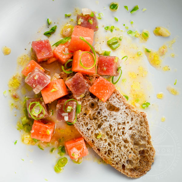 Watermelon and tuna crudo with olive oil on whole wheat bread