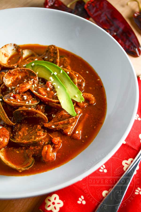 Red Pipian Seafood Soup, garnished with fresh avocado