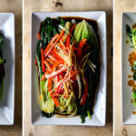 Three plates of Chinese green vegetables, prepared three different ways
