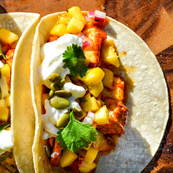 Yucatecan Fish Tacos with peach salsa, sour cream, and pumpkin seeds